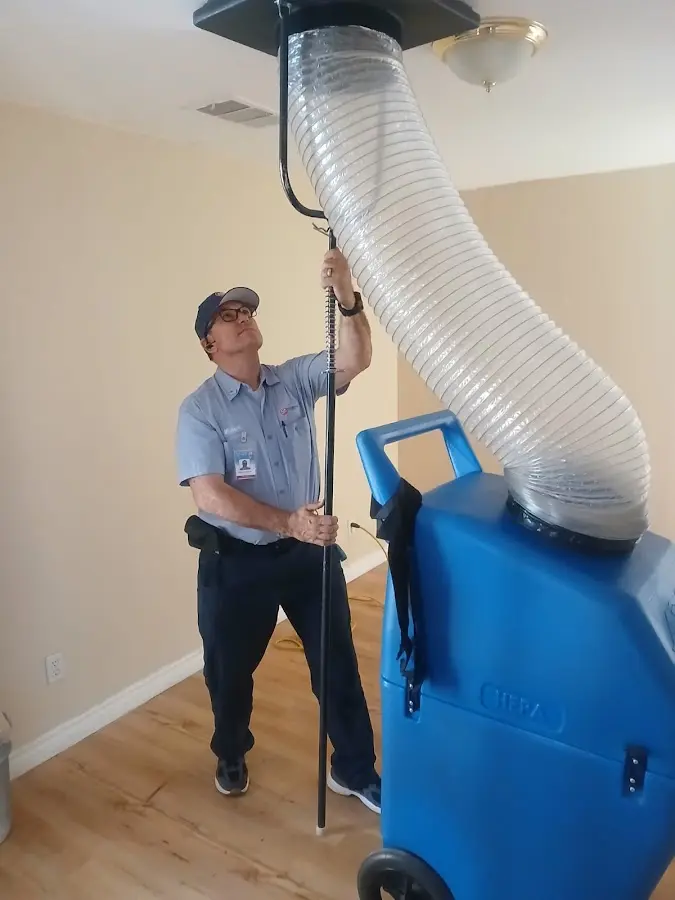 Mini Split Installation technician using HEPA equipment in Isanti